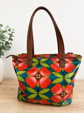 Fossil Key-Per tote bag featuring a vibrant, colorful floral pattern, guc